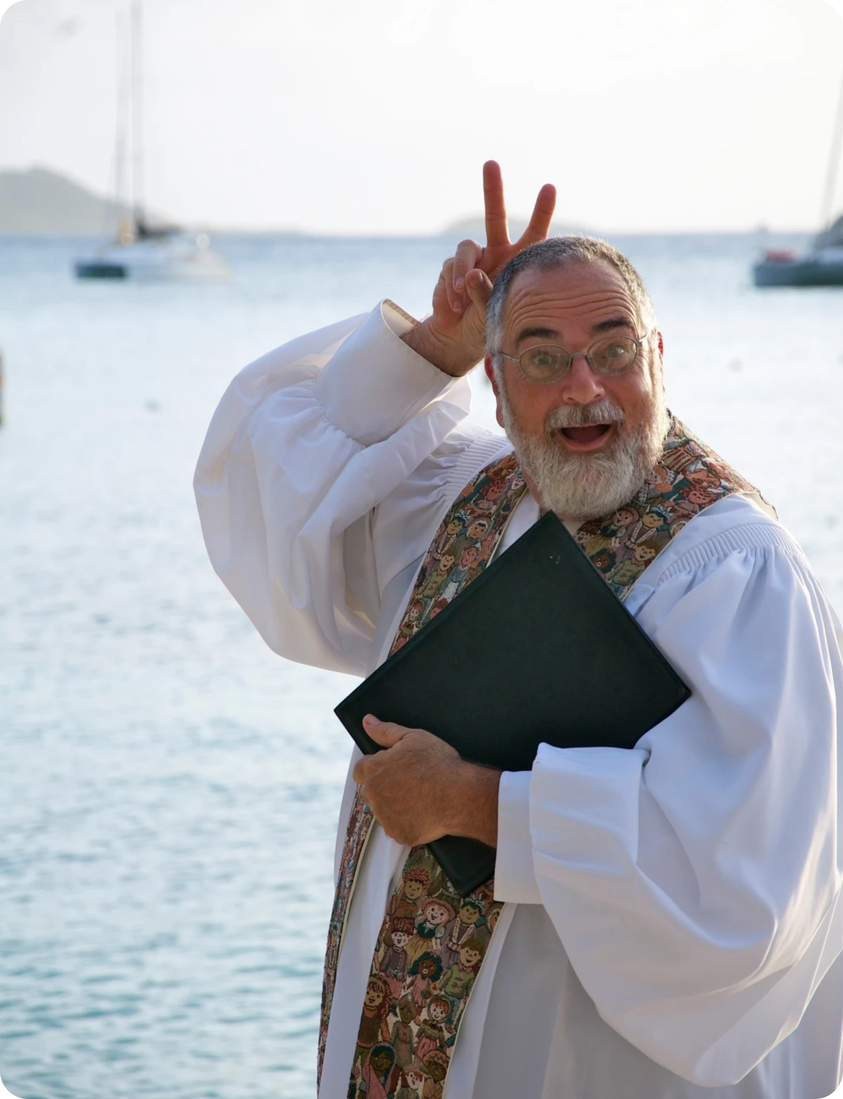 Man in robe making playful gesture