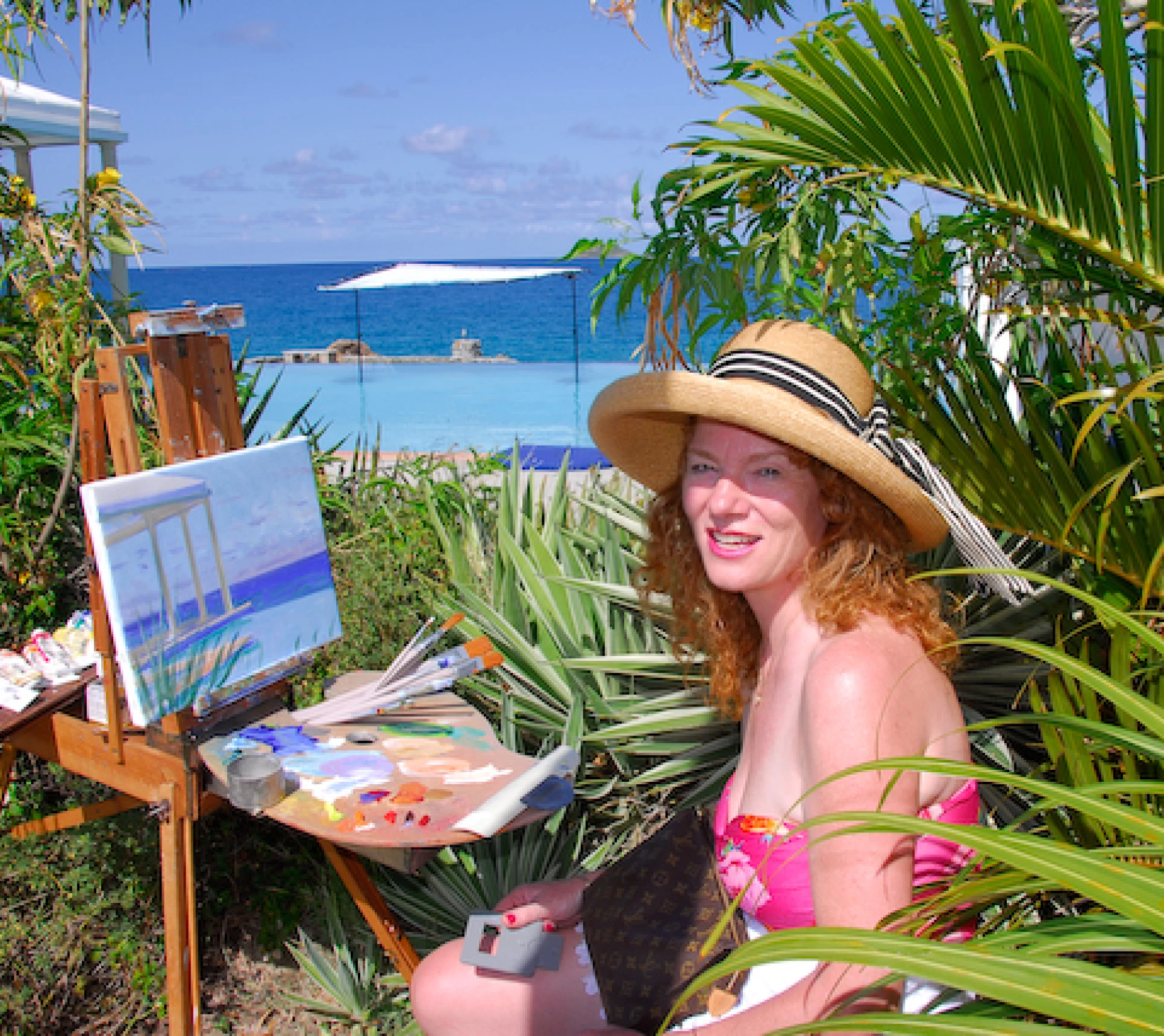 Woman painting by the seaside